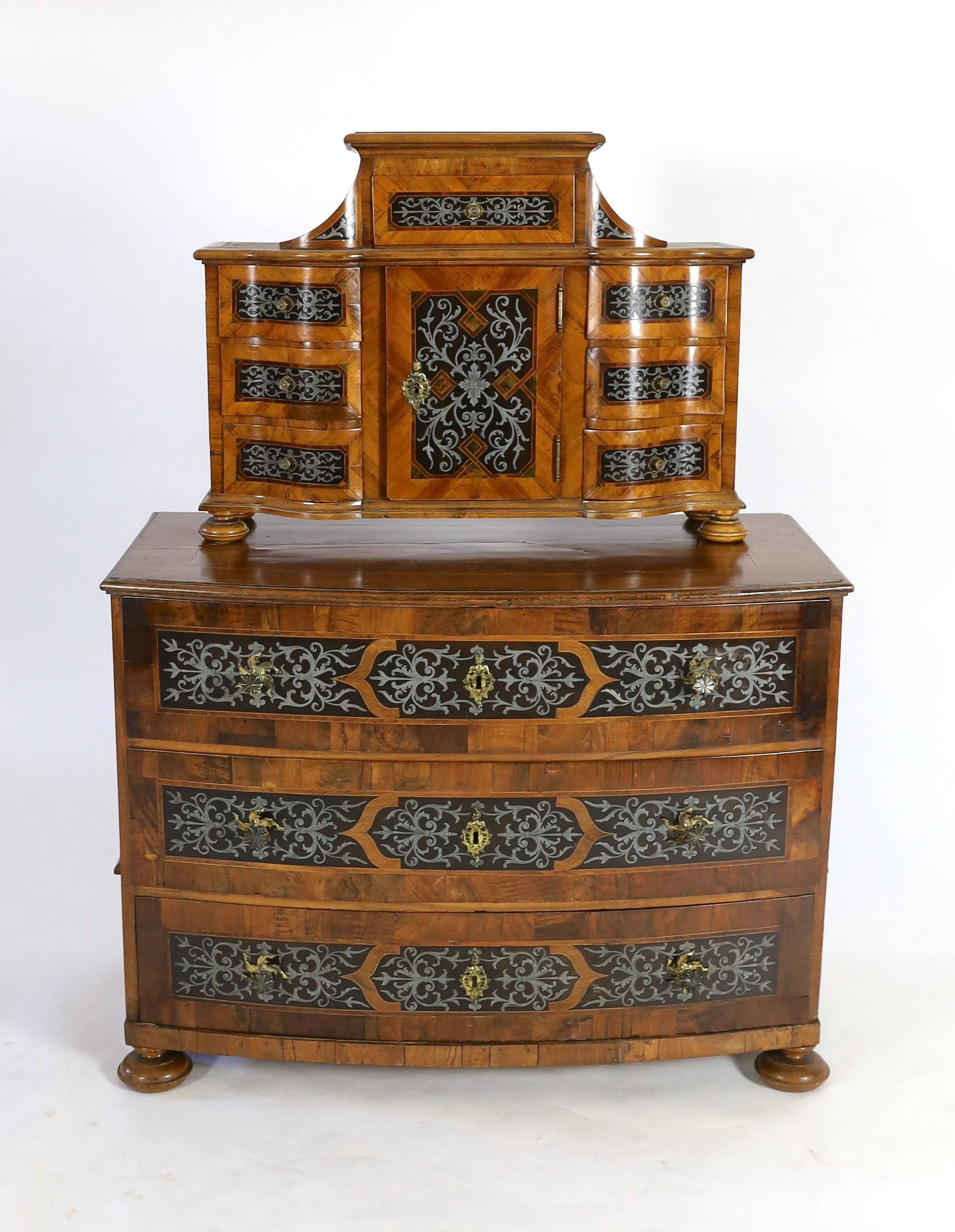 A South German walnut and cut pewter inlaid commode and matching tabernacle, second quarter 18th century, W.113cm D.57cm H.150cm